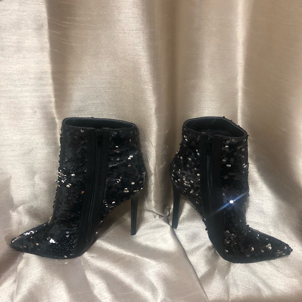 Black dazzling stiletto high heeled boots